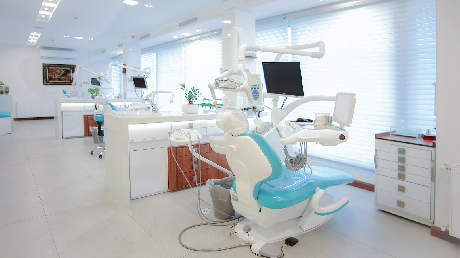 Bright multi-chair dental surgery ready for booked patients